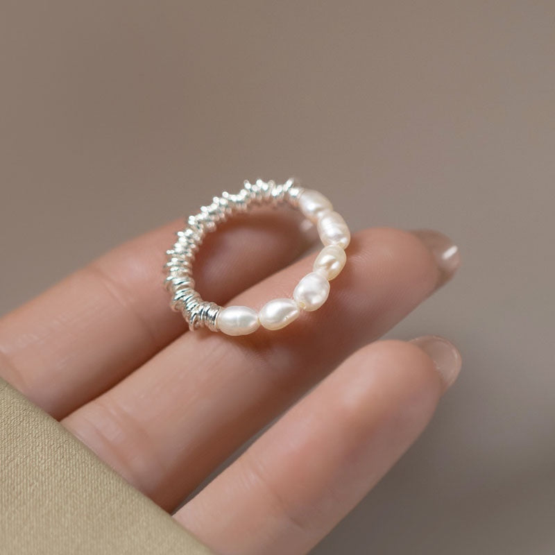 BoxUnboxed sterling silver coiled ring with irregular freshwater pearls. Minimalist, modern design.