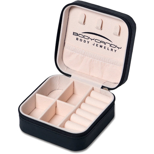 BoxUnboxed black travel jewelry box organizer with soft pink interior, ring rolls, and compartments.