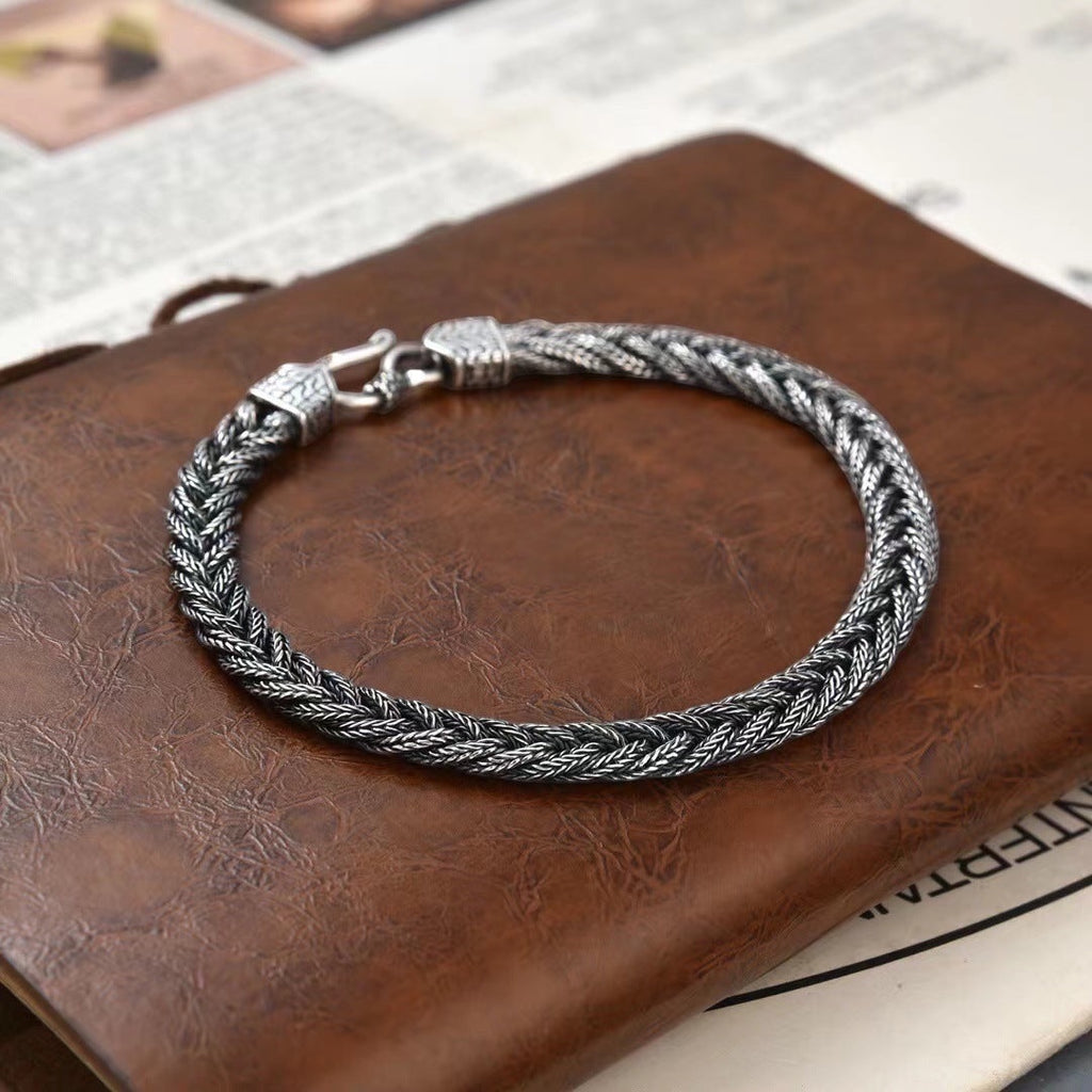 BoxUnboxed Sovereign Viking Vajra braided link chain bracelet in solid 925 silver with a hook clasp and oxidized finish.