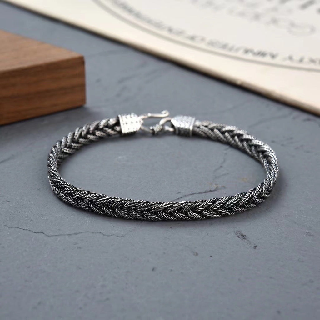 BoxUnboxed Sovereign Viking Vajra braided link chain bracelet in solid 925 silver with oxidized patina and hook clasp.