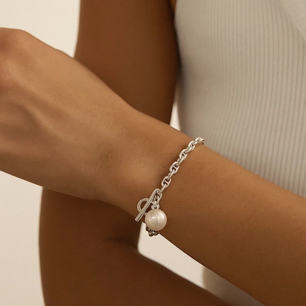 BoxUnboxed sterling silver anchor link bracelet with toggle clasp and single freshwater pearl charm.